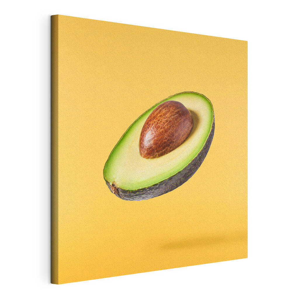 Avocado zweeft op geel, gespannen canvas met doorlopende rand