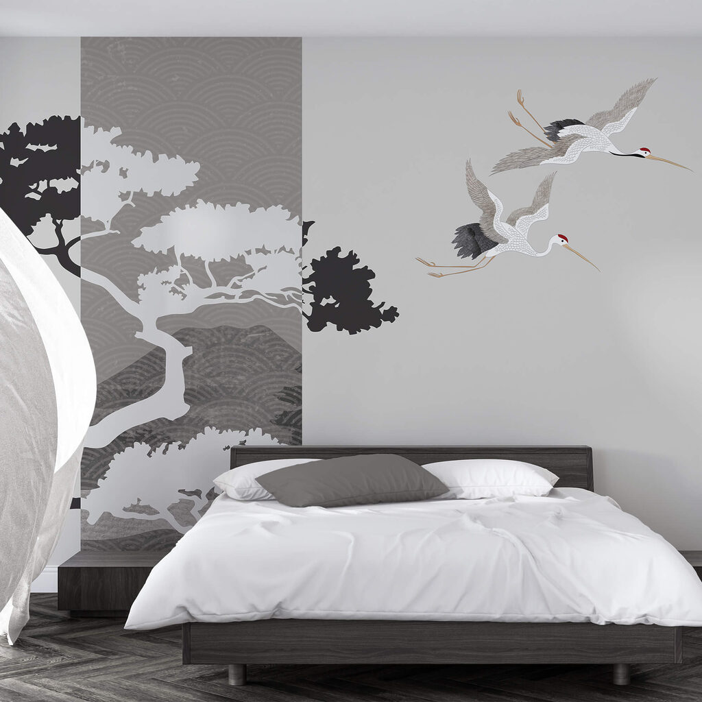 Een paar kraanvogels vliegen naast een boom in een interieur