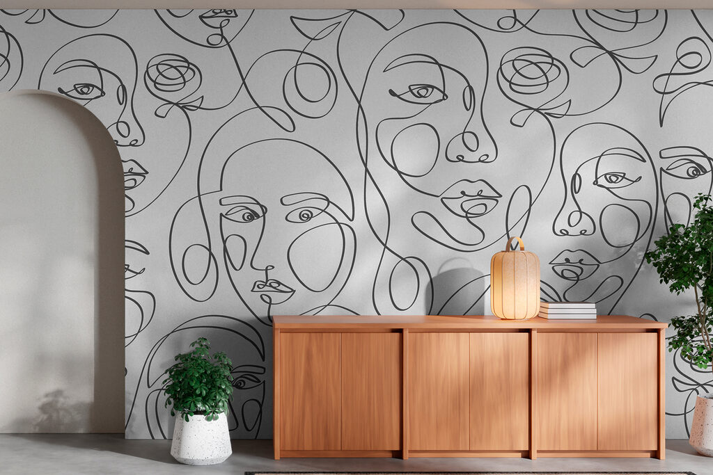 Patroon van gezichten getekend met zwarte lijnen in een interieur
